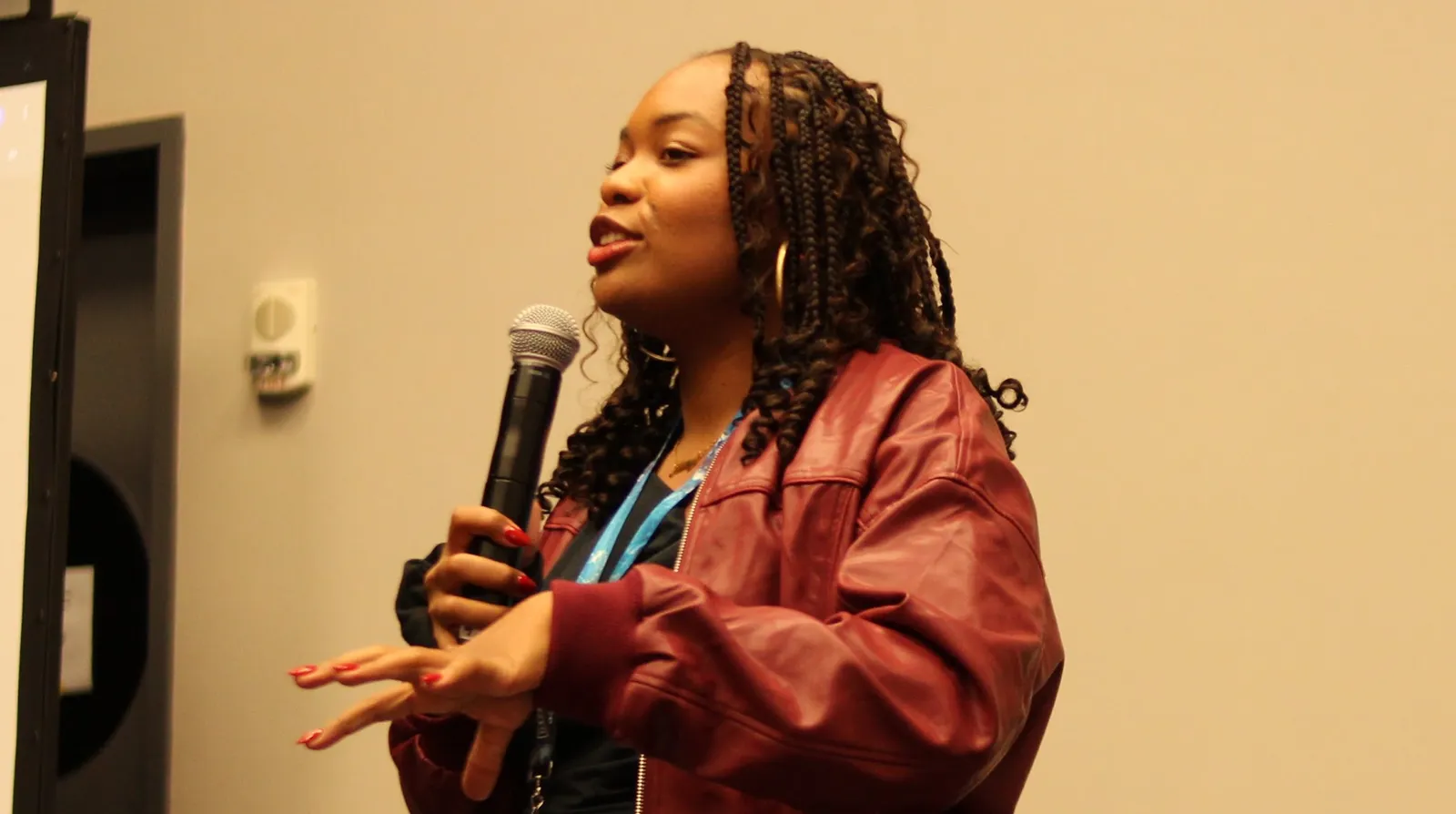 Mary Graves speaking to a workshop audience with a microphone